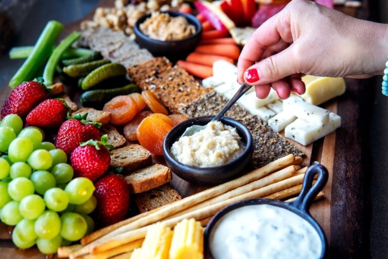 shopping table with gourmet food, fruits, vegetables and cheese